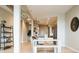 Bright, open living space, with industrial duct work and seamlessly connecting dining and kitchen areas at 3198 Blake St # 402, Denver, CO 80205