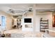 Spacious living area with industrial ductwork, ample natural light, and minimalist decor at 3198 Blake St # 402, Denver, CO 80205
