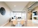 Bright, open-plan living room with sleek decor and exposed ductwork at 3198 Blake St # 402, Denver, CO 80205