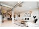 Inviting living room with modern industrial design, light wood floors, and comfortable seating at 3198 Blake St # 402, Denver, CO 80205