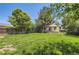 Well maintained lawn in the private backyard of this single story home, with mature landscaping and wood fence at 4111 S Delaware St, Englewood, CO 80110