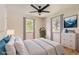 Bright bedroom with large windows, ceiling fan, and stylish furnishings at 4111 S Delaware St, Englewood, CO 80110
