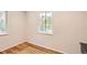 Bright bedroom with hardwood floors, neutral paint, and natural light at 4111 S Delaware St, Englewood, CO 80110