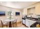 Eat-in kitchen with stainless steel appliances and modern finishes at 4111 S Delaware St, Englewood, CO 80110