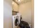 Functional laundry room with washer, dryer, and storage cabinets at 4111 S Delaware St, Englewood, CO 80110