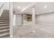Spacious basement featuring carpet floors and built-in shelving with a wood accent wall at 11482 Colony Loop, Parker, CO 80138