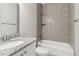 Bathroom featuring a granite countertop vanity, and tiled shower over tub at 11482 Colony Loop, Parker, CO 80138