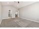 Large bedroom showing carpet floors, with easy access to a bathroom and kitchen at 11482 Colony Loop, Parker, CO 80138