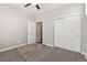 Bedroom featuring carpeted floors and a closet with double sliding doors at 11482 Colony Loop, Parker, CO 80138