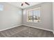 Bedroom featuring carpeted floors, a ceiling fan, and two windows allowing for great natural light at 11482 Colony Loop, Parker, CO 80138