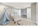 Bedroom set up as playroom with play tent, desk, and toy train at 11482 Colony Loop, Parker, CO 80138