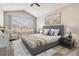 This bedroom features a large window, grey carpet, and a modern upholstered bed frame at 11482 Colony Loop, Parker, CO 80138