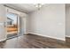 Dining room featuring hardwood floors, a chandelier, and sliding doors that lead to the outside at 11482 Colony Loop, Parker, CO 80138