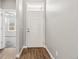 Bright entryway featuring wood floors and a view into the front living area at 11482 Colony Loop, Parker, CO 80138