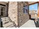 Close-up of the stone accent facade, the covered porch and the front entry way at 11482 Colony Loop, Parker, CO 80138