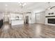 Bright open-concept living room and kitchen space featuring ample natural light at 11482 Colony Loop, Parker, CO 80138