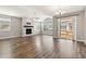 Spacious living room with fireplace, and vaulted ceiling with natural lighting at 11482 Colony Loop, Parker, CO 80138