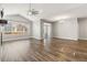 Living room boasting vaulted ceilings, fan, fireplace and a sliding glass door at 11482 Colony Loop, Parker, CO 80138