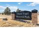 Sign for Chuck Vogel Memorial Park with stone accents and a well-maintained lawn at 11482 Colony Loop, Parker, CO 80138