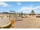 Community playground featuring a slide, climbing structures, and other play equipment for children at 11482 Colony Loop, Parker, CO 80138