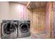 Laundry room featuring a modern LG washer and dryer next to unfinished storage at 11405 Conifer Ridge Dr, Conifer, CO 80433