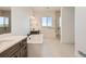 Luxurious bathroom with a soaking tub, double vanities, and a glass-enclosed shower at 668 Leafy Aster Ln, Castle Rock, CO 80104