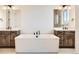 Elegant bathroom featuring a freestanding tub, double vanities, and modern fixtures at 668 Leafy Aster Ln, Castle Rock, CO 80104