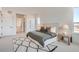 Inviting bedroom showcasing ample natural light, neutral decor, and a view to the neighborhood at 668 Leafy Aster Ln, Castle Rock, CO 80104