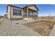 Charming single-Gathering home with a covered porch and neutral colored exterior at 668 Leafy Aster Ln, Castle Rock, CO 80104