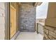 Inviting front porch with stone detailing and wood accents, adding a touch of elegance to the home's entrance at 668 Leafy Aster Ln, Castle Rock, CO 80104