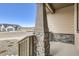 Charming front porch featuring stone and wood accents, creating a warm and inviting entryway to the home at 668 Leafy Aster Ln, Castle Rock, CO 80104