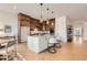 Modern kitchen featuring a central island, stainless steel appliances, and ample cabinet space for culinary enthusiasts at 668 Leafy Aster Ln, Castle Rock, CO 80104