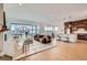 Bright open-concept space with living, dining and kitchen areas offers an open and welcoming design at 668 Leafy Aster Ln, Castle Rock, CO 80104
