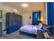 Stylish bedroom featuring a large built in closet and blue accents at 1739 E Martin Luther King Jr Blvd, Denver, CO 80205