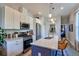 Bright kitchen featuring a kitchen island with bar seating and stainless steel appliances at 1739 E Martin Luther King Jr Blvd, Denver, CO 80205