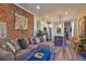 Open-concept living space with exposed brick, modern kitchen, and comfortable seating at 1739 E Martin Luther King Jr Blvd, Denver, CO 80205