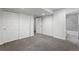 Bright basement bedroom with ample closet space and a full bathroom at 4727 Raven Run, Broomfield, CO 80023