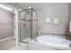 Elegant bathroom with soaking tub, shower, and double vanity at 4727 Raven Run, Broomfield, CO 80023