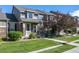 Townhome with a charming front porch and walkway at 4727 Raven Run, Broomfield, CO 80023