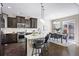 Eat-in kitchen with island seating and access to backyard at 4727 Raven Run, Broomfield, CO 80023