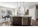 Island kitchen with stainless steel appliances and granite countertops at 4727 Raven Run, Broomfield, CO 80023