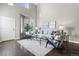 Bright living room featuring hardwood floors and a high ceiling at 4727 Raven Run, Broomfield, CO 80023