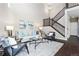 Spacious living room with hardwood floors and high ceilings at 4727 Raven Run, Broomfield, CO 80023
