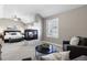 Main bedroom with sitting area and fireplace at 4727 Raven Run, Broomfield, CO 80023