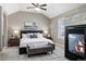 Main bedroom featuring a king-size bed and fireplace at 4727 Raven Run, Broomfield, CO 80023