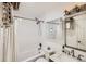 Bathroom with a white shower curtain and a chrome shower head attached to the tiled shower walls at 4882 E Kentucky Ave # A, Denver, CO 80246
