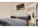 Comfortable bedroom with TV and easy access to living room and hallway at 4882 E Kentucky Ave # A, Denver, CO 80246