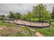 Community dog park with mature trees, green grass, and plenty of open space for recreation at 4882 E Kentucky Ave # A, Denver, CO 80246