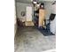 Functional garage space with an electric car charger, shelving and plenty of room for storage and a fitness bike at 4882 E Kentucky Ave # A, Denver, CO 80246