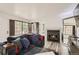 Comfortable living room with fireplace, shutters, and stylish decor at 4882 E Kentucky Ave # A, Denver, CO 80246